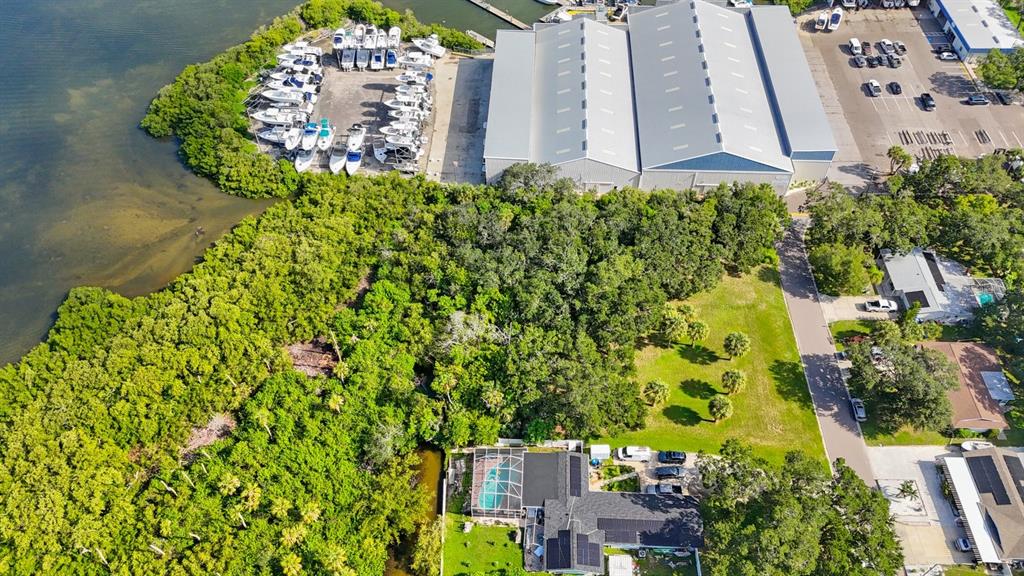 145th Lane Largo, FL 33774 - Photo 24 of 29 a picture of a building with a lot of flower plants