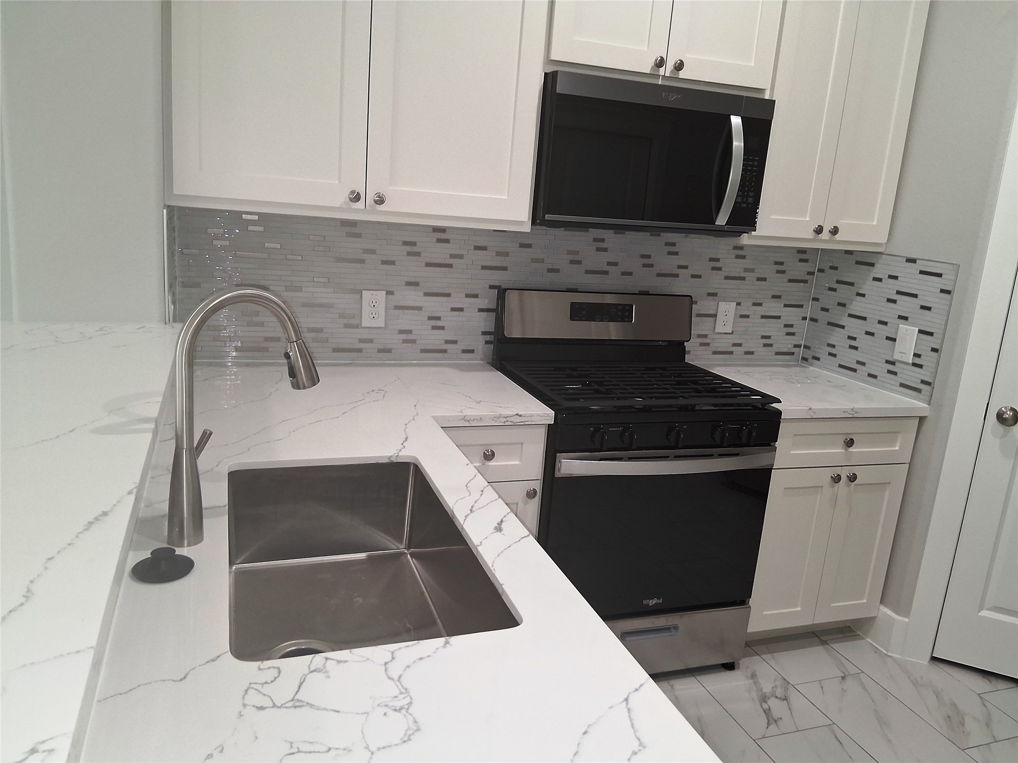 790 Fair Street, Unit A Houston, TX 77088 - Photo 2 of 14 Kitchen area with gas tove,Microwave & Ref