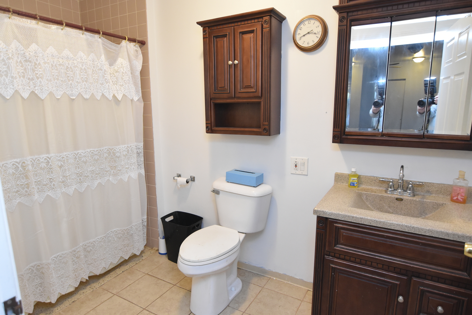 141 West 124th Street Chicago, IL 60628 - Photo 17 of 26 a bathroom with a toilet a sink and a mirror