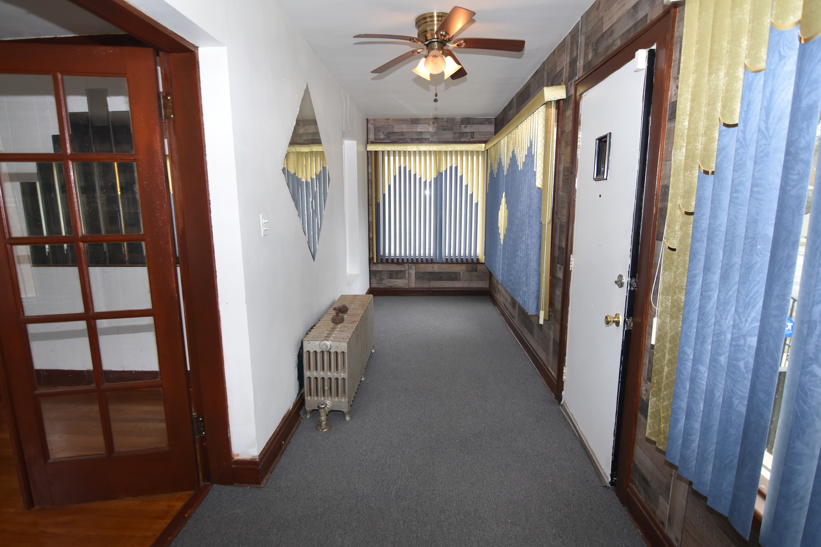 141 West 124th Street Chicago, IL 60628 - Photo 8 of 26 a view of a hallway with windows and entryway