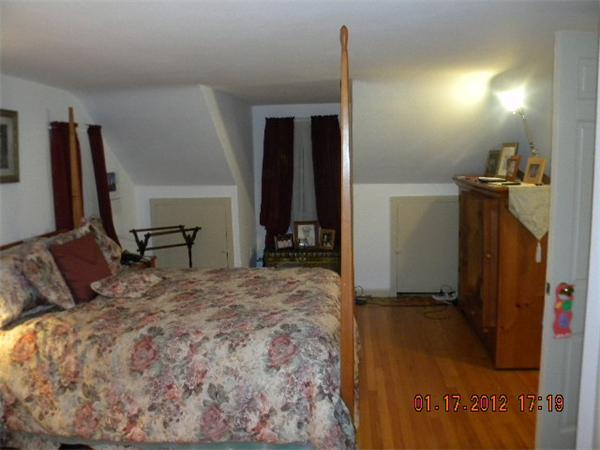 125 Newton Road Springfield, MA 01118 - Photo 14 of 24 a bedroom with a bed and a desk in it