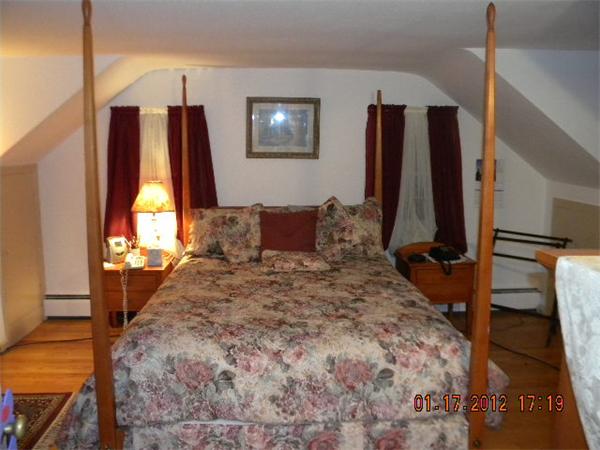 125 Newton Road Springfield, MA 01118 - Photo 15 of 24 a bedroom with a bed and a walk in closet