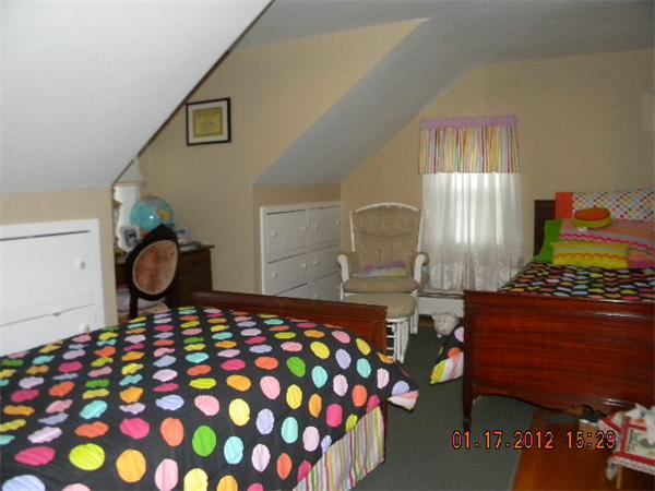 125 Newton Road Springfield, MA 01118 - Photo 17 of 24 a bedroom with a bed and window