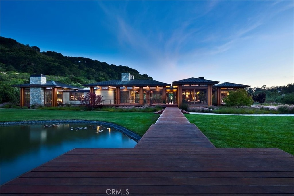 1604 Tiffany Ranch Road Arroyo Grande, CA 93420 - Photo 15 of 32 a view of a lake with a garden and table