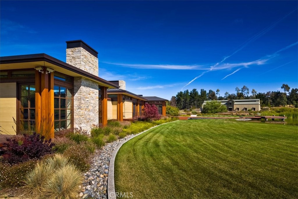 1604 Tiffany Ranch Road Arroyo Grande, CA 93420 - Photo 2 of 32 a front view of a house with a yard
