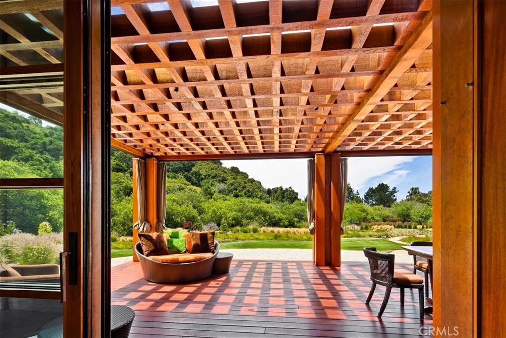 1604 Tiffany Ranch Road Arroyo Grande, CA 93420 - Photo 4 of 32 a view of a patio with a dining table and chairs
