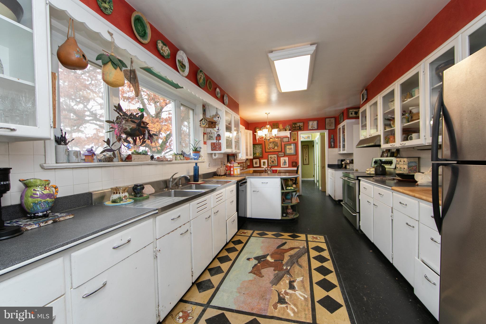 478 Highway 40 Elmer, NJ 08318 - Photo 28 of 65 a kitchen with stainless steel appliances sink stove and cabinets
