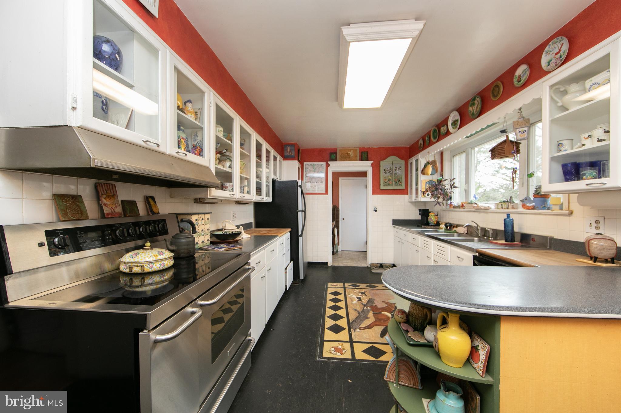 478 Highway 40 Elmer, NJ 08318 - Photo 29 of 65 a kitchen with stainless steel appliances granite countertop a stove and a refrigerator