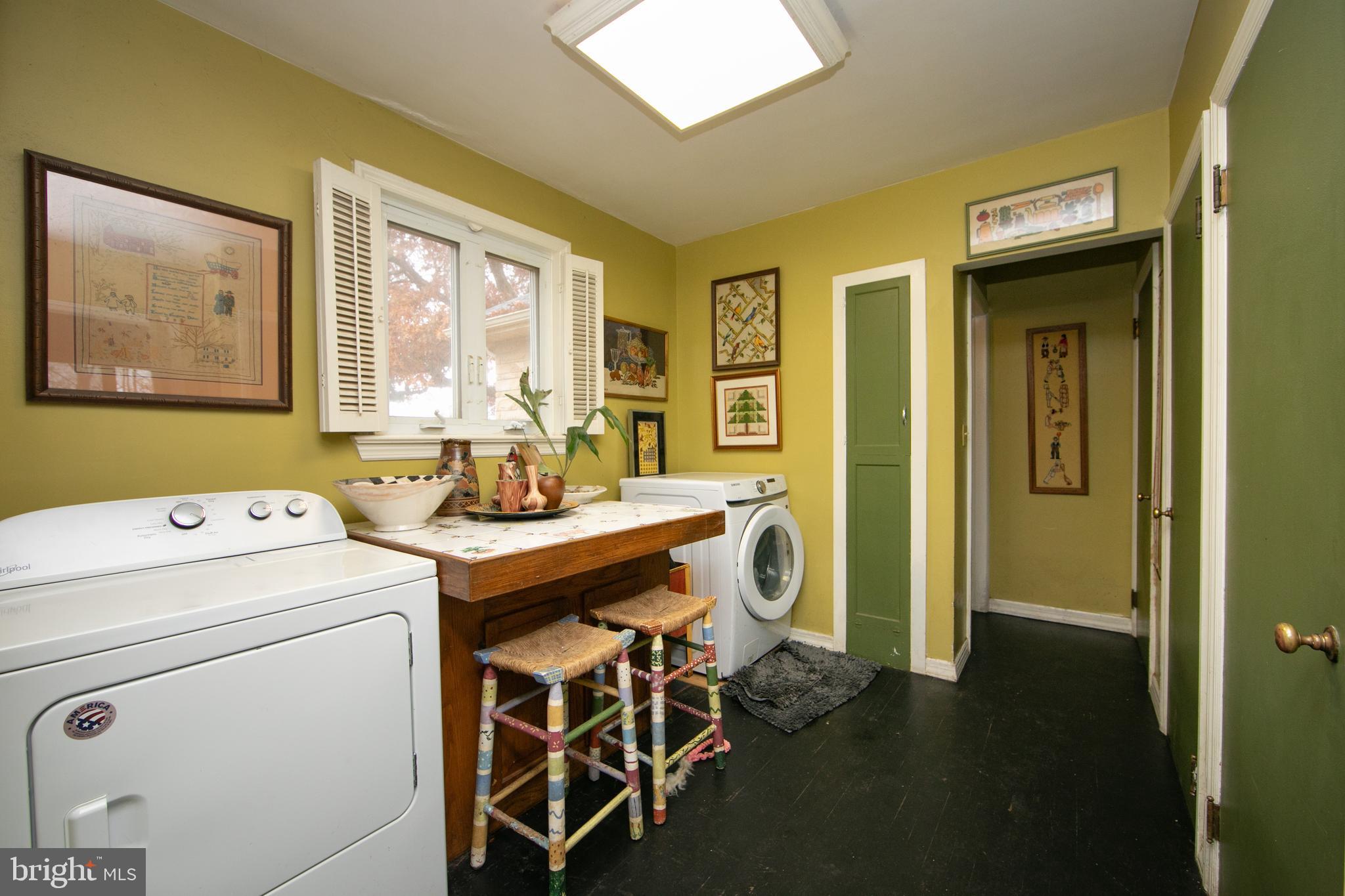 478 Highway 40 Elmer, NJ 08318 - Photo 31 of 65 a view of washer and dryer with kitchen view