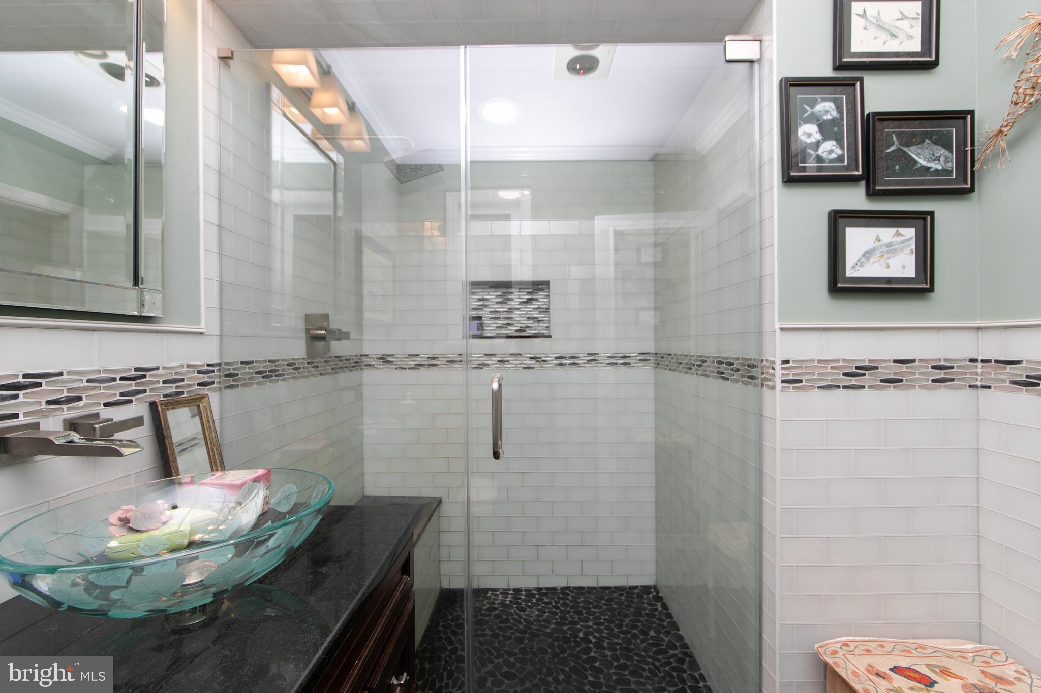 478 Highway 40 Elmer, NJ 08318 - Photo 36 of 65 a bathroom with a sink and a mirror