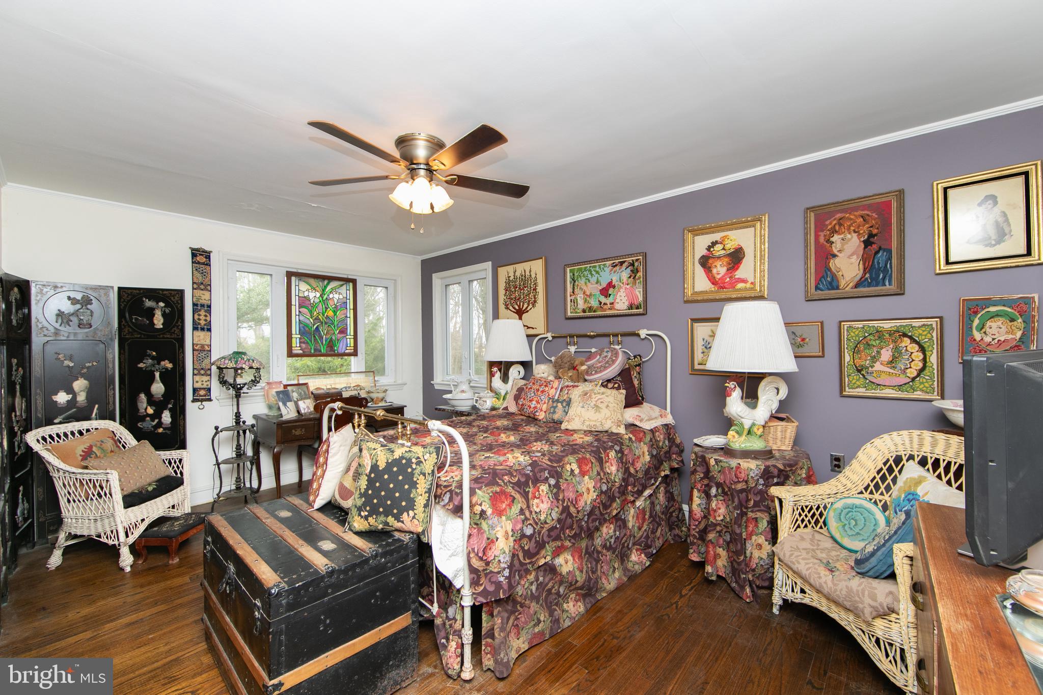 478 Highway 40 Elmer, NJ 08318 - Photo 37 of 65 a bedroom with two beds and painting on the wall