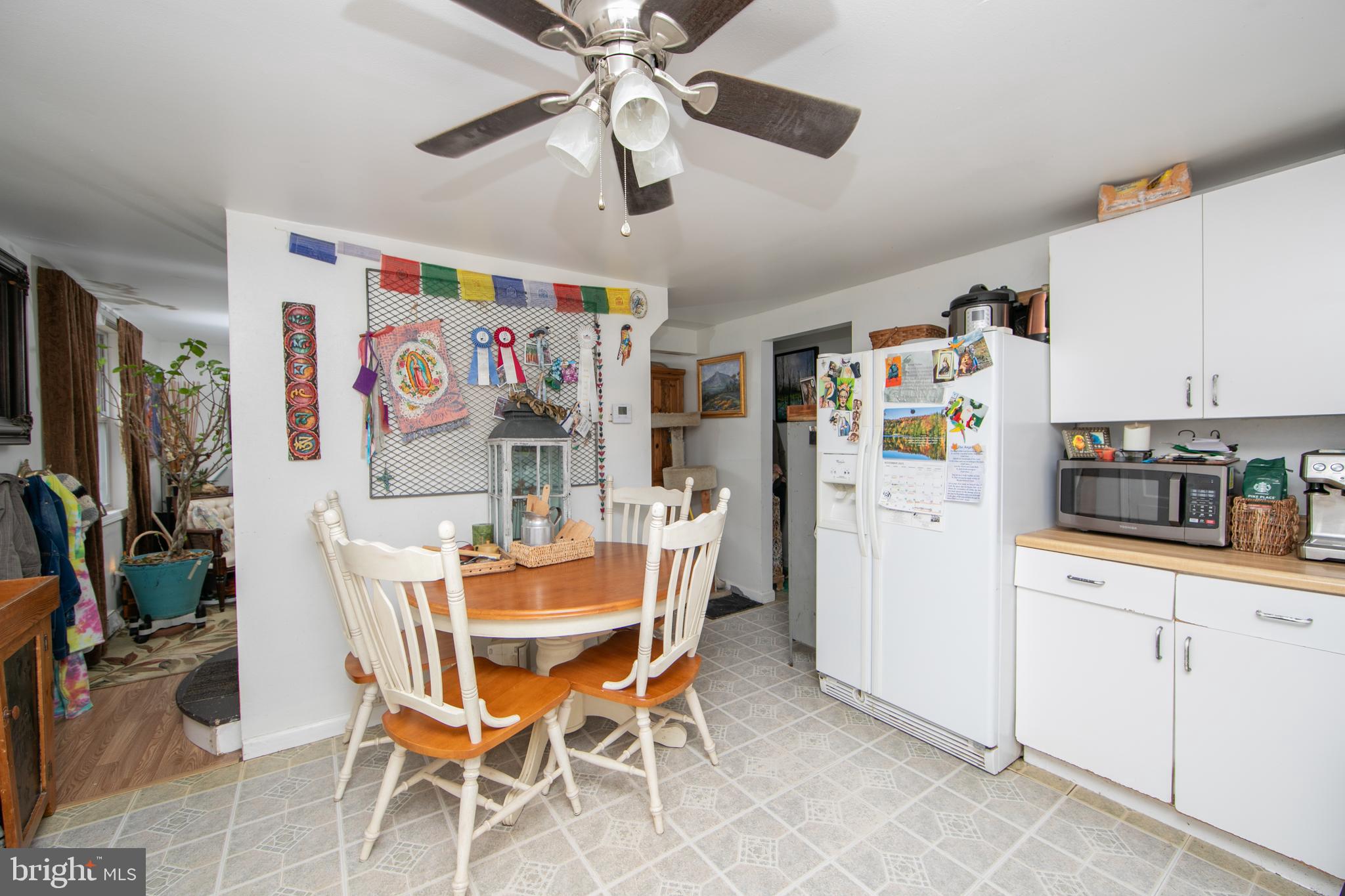 478 Highway 40 Elmer, NJ 08318 - Photo 49 of 65 a dining room with furniture and kitchen view