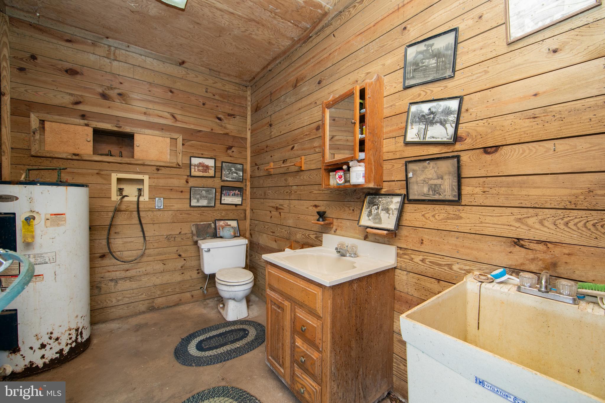 478 Highway 40 Elmer, NJ 08318 - Photo 58 of 65 a bathroom with a sink a toilet and shower