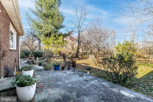 a view of a backyard with wooden floor and lake view