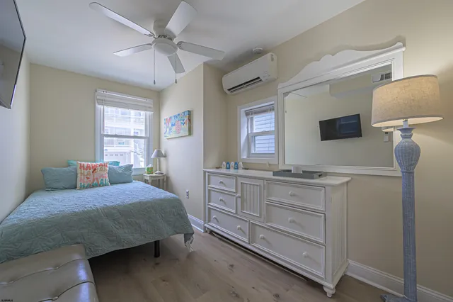 a bedroom with a bed and a dresser