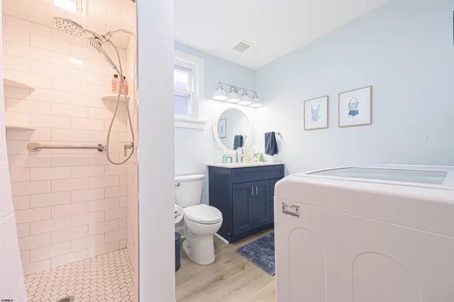 a bathroom with a sink toilet and shower