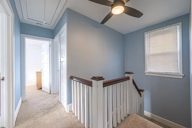a view of a hallway to a window