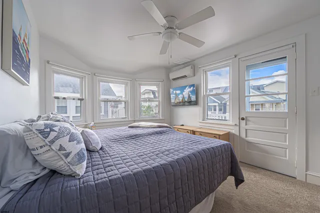 a bedroom with a large bed and a window