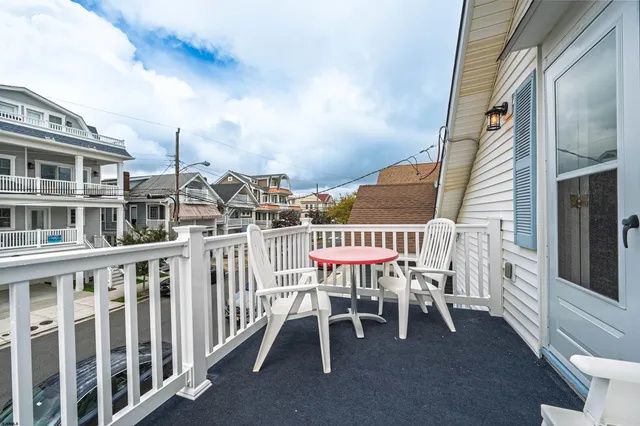 a view of a chair and table in the balcony