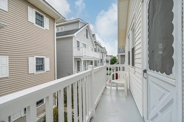 a view of a house with a small yard