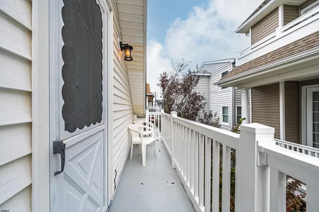 a view of a balcony with wooden floor