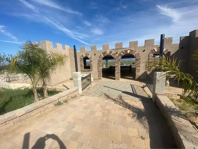 a view of a balcony with chairs