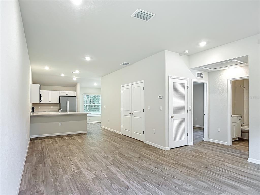 827 Hickory Avenue Inverness, FL 34452 - Photo 2 of 9 a living room with stainless steel appliances kitchen island wooden floors and view living room