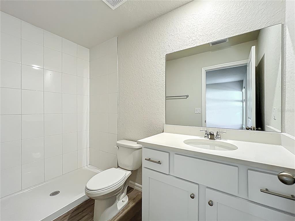 827 Hickory Avenue Inverness, FL 34452 - Photo 6 of 9 a bathroom with a sink toilet and shower