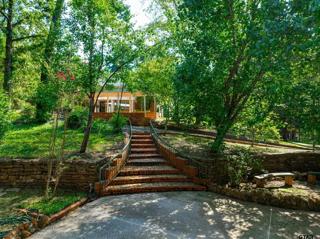 a view of a garden with a building