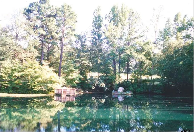 a view of lake with green space