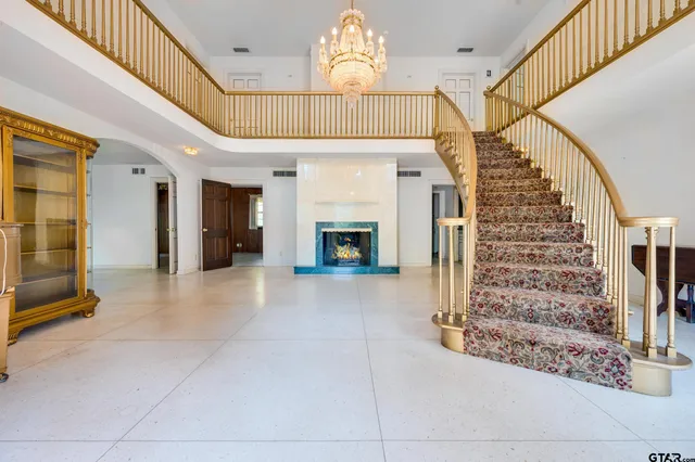 an empty room with windows and entrance