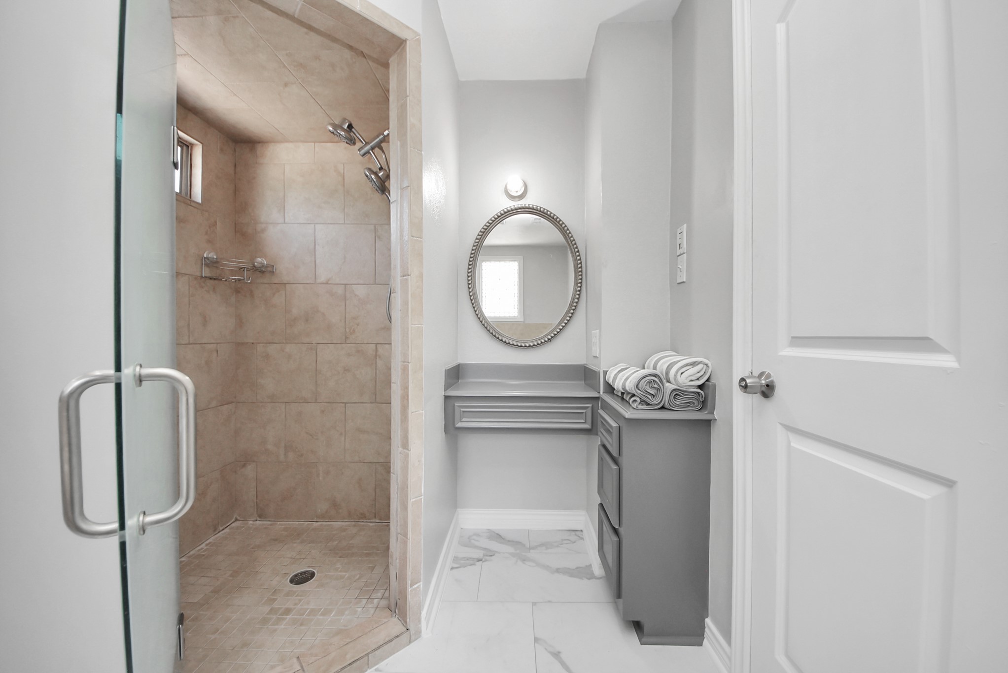 1011 Whitestone Lane Houston, TX 77073 - Photo 21 of 48 a bathroom with a shower a mirror and a sink
