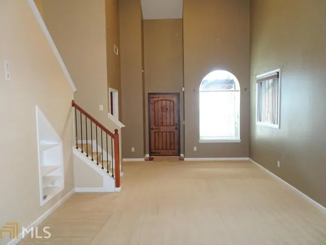 an empty room with windows