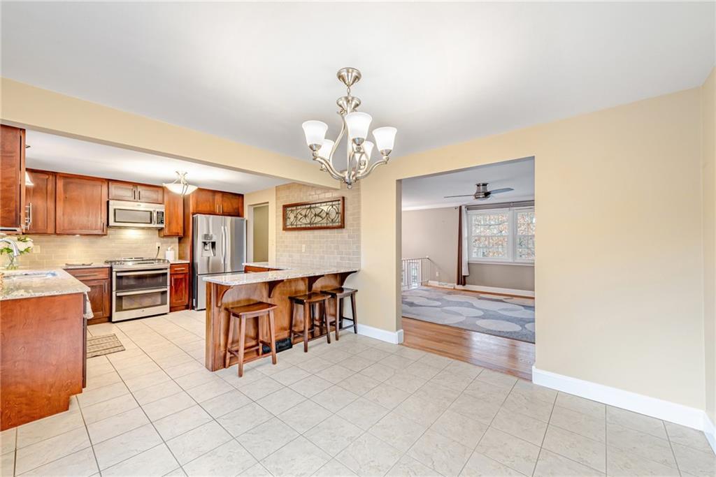 162 Hermitage Circle Ligonier, PA 15658 - Photo 11 of 38 a view of a dining room with furniture and chandelier