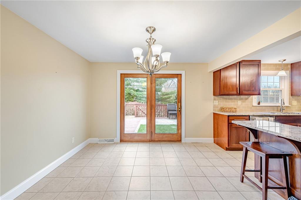 162 Hermitage Circle Ligonier, PA 15658 - Photo 13 of 38 a view of kitchen with granite countertop cabinets and outdoor space