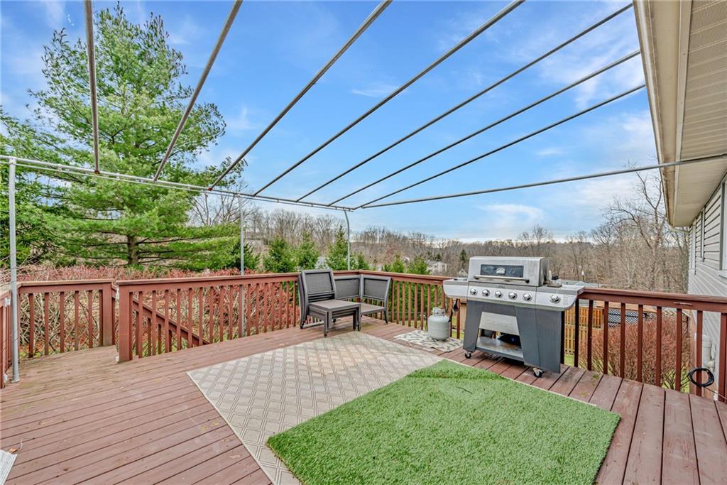 162 Hermitage Circle Ligonier, PA 15658 - Photo 14 of 38 a view of a roof deck with couches wooden fence and floor