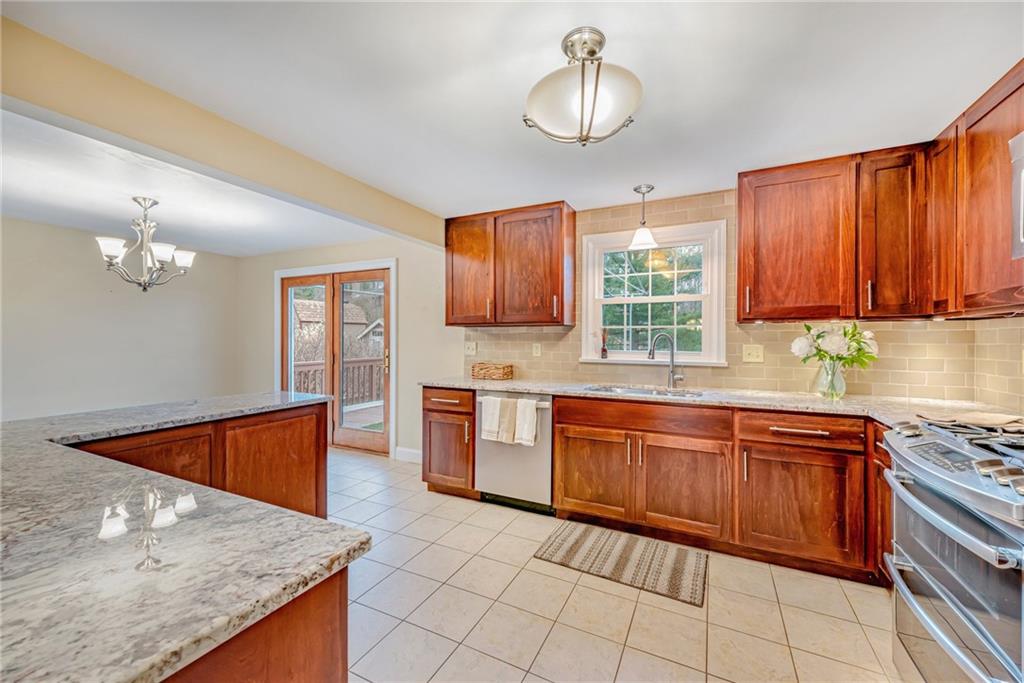 162 Hermitage Circle Ligonier, PA 15658 - Photo 18 of 38 a kitchen with stainless steel appliances granite countertop a sink dishwasher stove and refrigerator