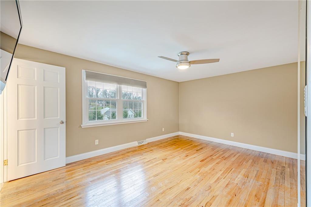 162 Hermitage Circle Ligonier, PA 15658 - Photo 21 of 38 a view of an empty room with wooden floor and a window