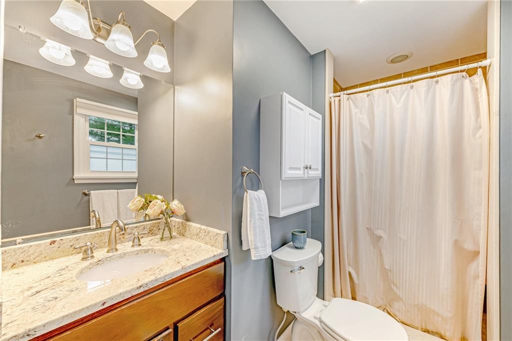162 Hermitage Circle Ligonier, PA 15658 - Photo 23 of 38 a bathroom with a granite countertop sink toilet and shower