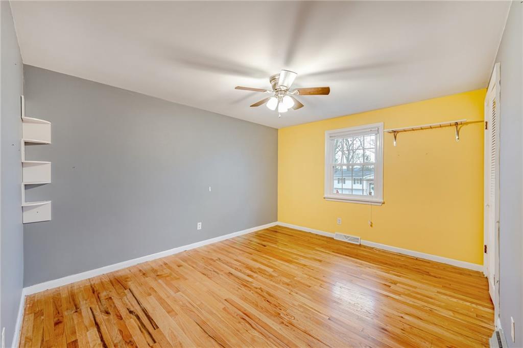 162 Hermitage Circle Ligonier, PA 15658 - Photo 26 of 38 a view of empty room with wooden floor and fan