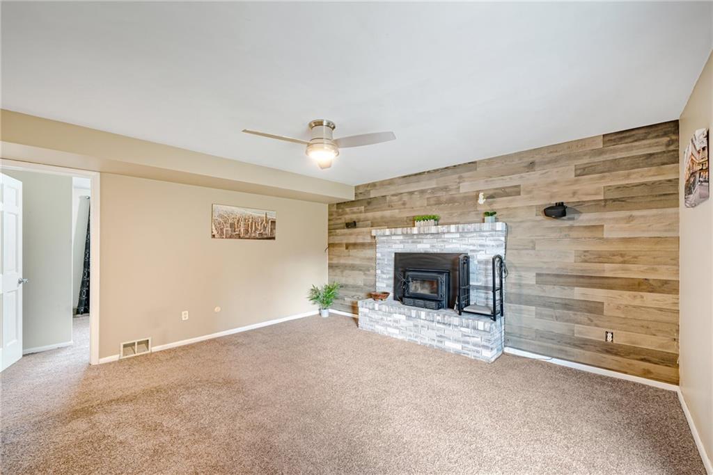 162 Hermitage Circle Ligonier, PA 15658 - Photo 32 of 38 a view of an empty room with a fireplace and a window