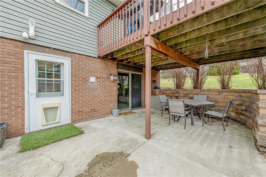 162 Hermitage Circle Ligonier, PA 15658 - Photo 33 of 38 a view of a patio with table and chairs and a barbeque