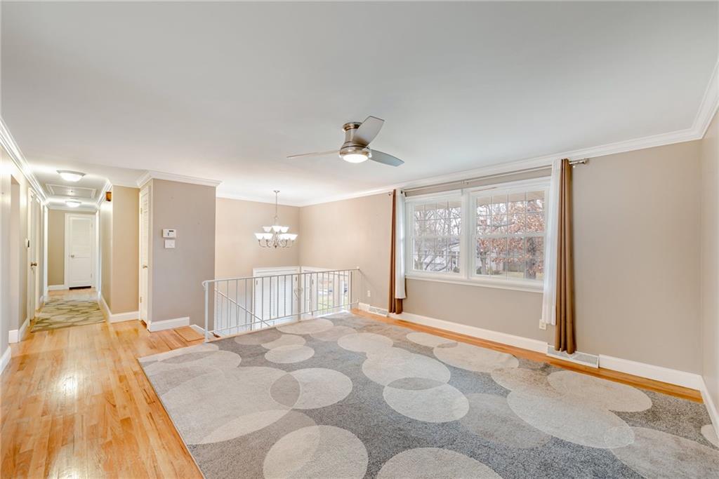 162 Hermitage Circle Ligonier, PA 15658 - Photo 7 of 38 a view of a livingroom with a dinning area hardwood floor and a ceiling fan