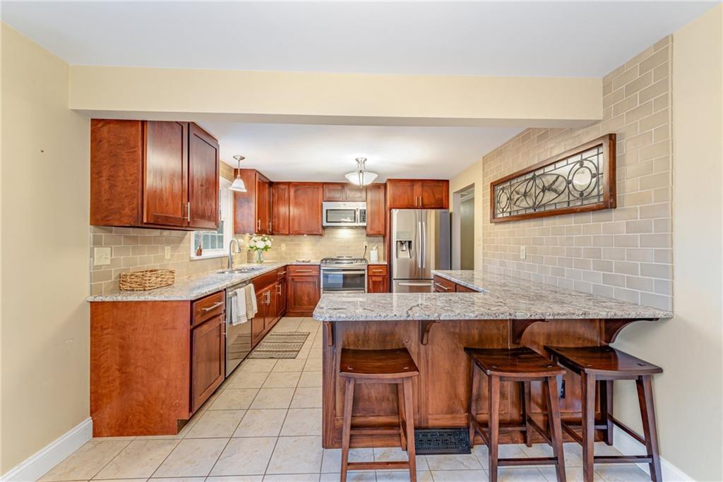162 Hermitage Circle Ligonier, PA 15658 - Photo 10 of 38 a large kitchen with cabinets table and chairs