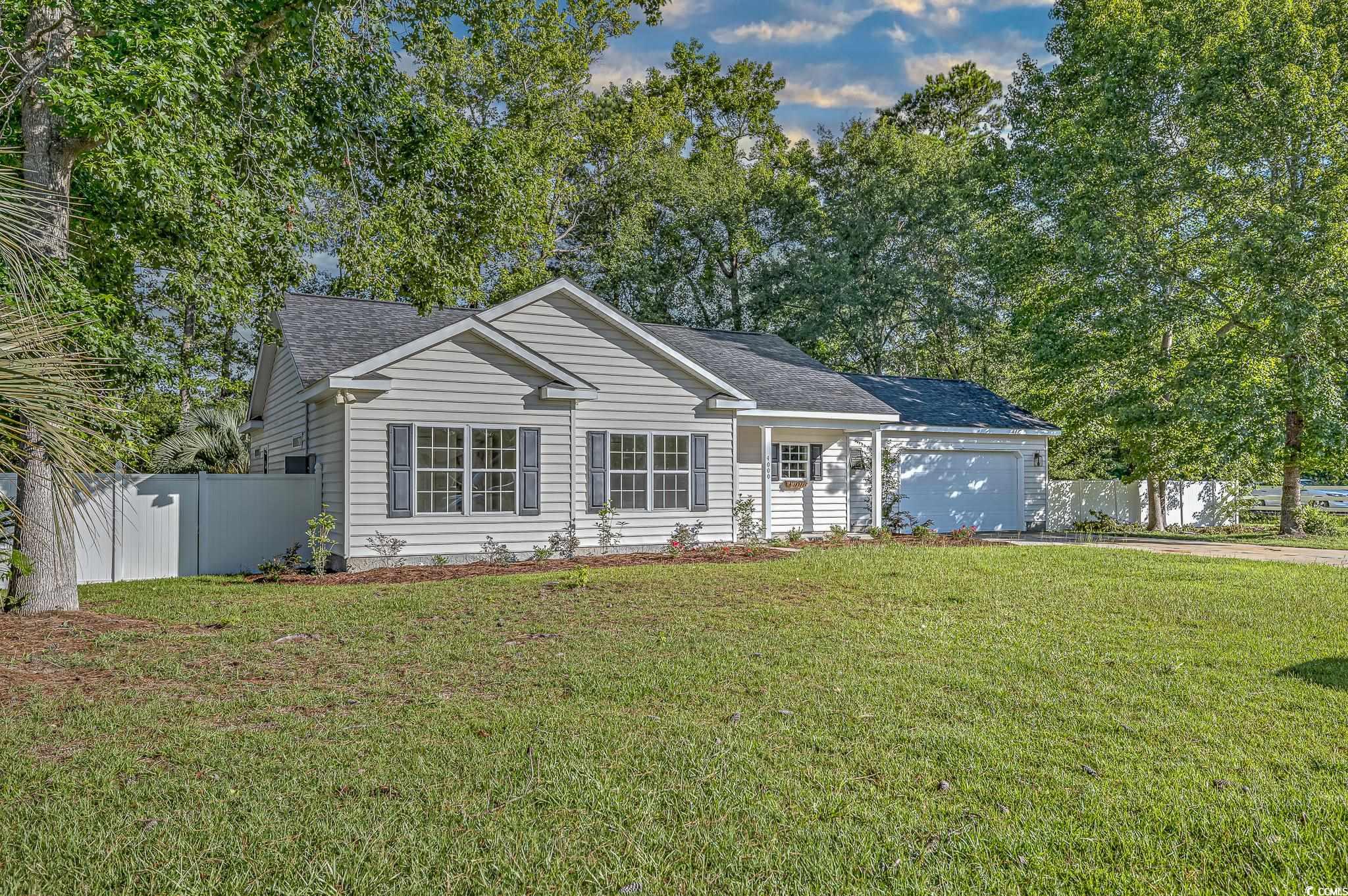 4000 Bayfield Loop Murrells Inlet, SC 29576 - Photo 1 of 33 Ranch-style home featuring an attached garage, driveway, and a shingled roof