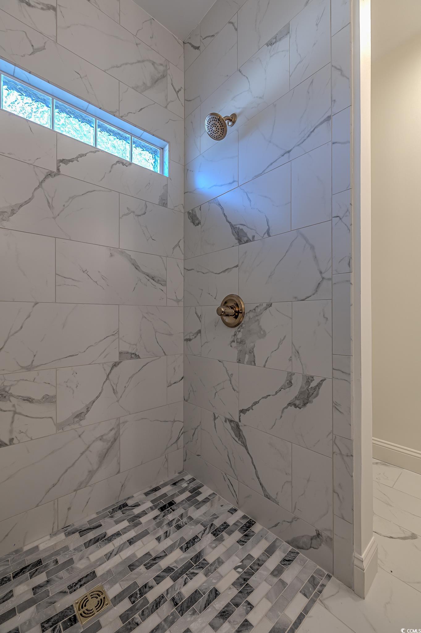 4000 Bayfield Loop Murrells Inlet, SC 29576 - Photo 15 of 33 Full bath featuring marble look tiles and tiled shower