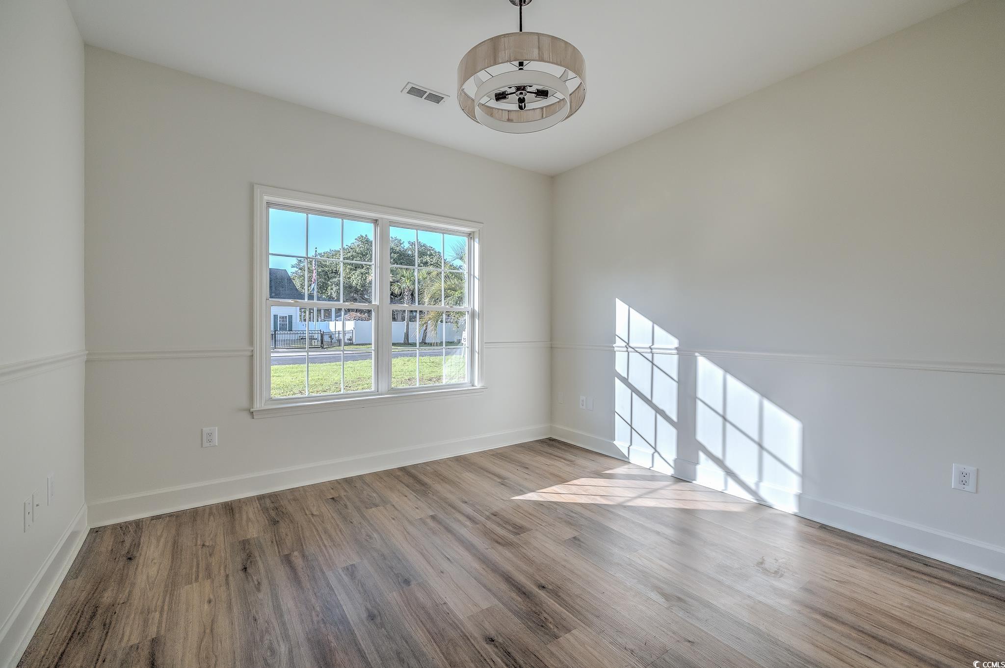 4000 Bayfield Loop Murrells Inlet, SC 29576 - Photo 19 of 33 Empty room with wood finished floors and baseboards