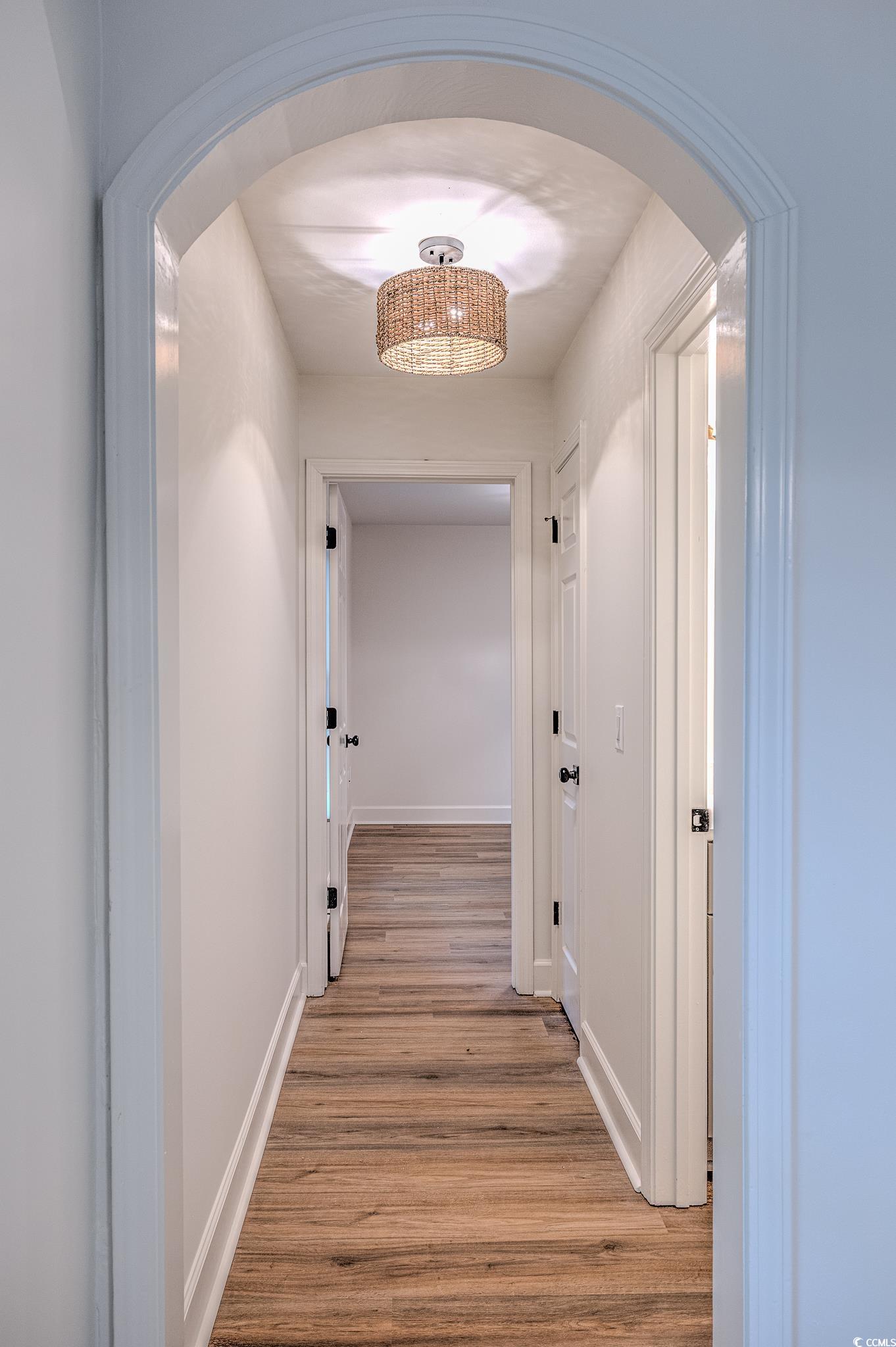 4000 Bayfield Loop Murrells Inlet, SC 29576 - Photo 30 of 33 Hall featuring arched walkways and light wood finished floors