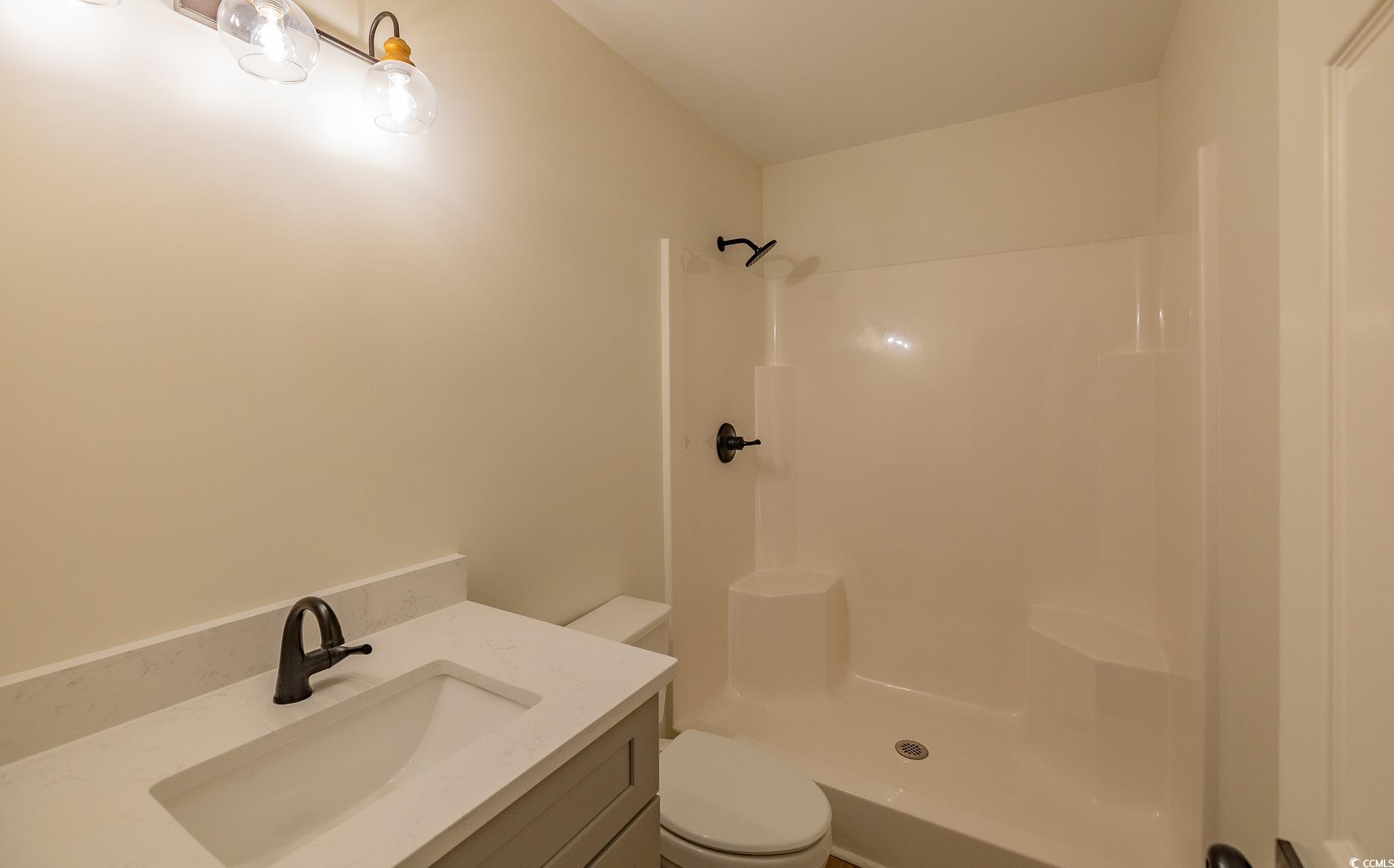 4000 Bayfield Loop Murrells Inlet, SC 29576 - Photo 33 of 33 Bathroom with vanity and a shower