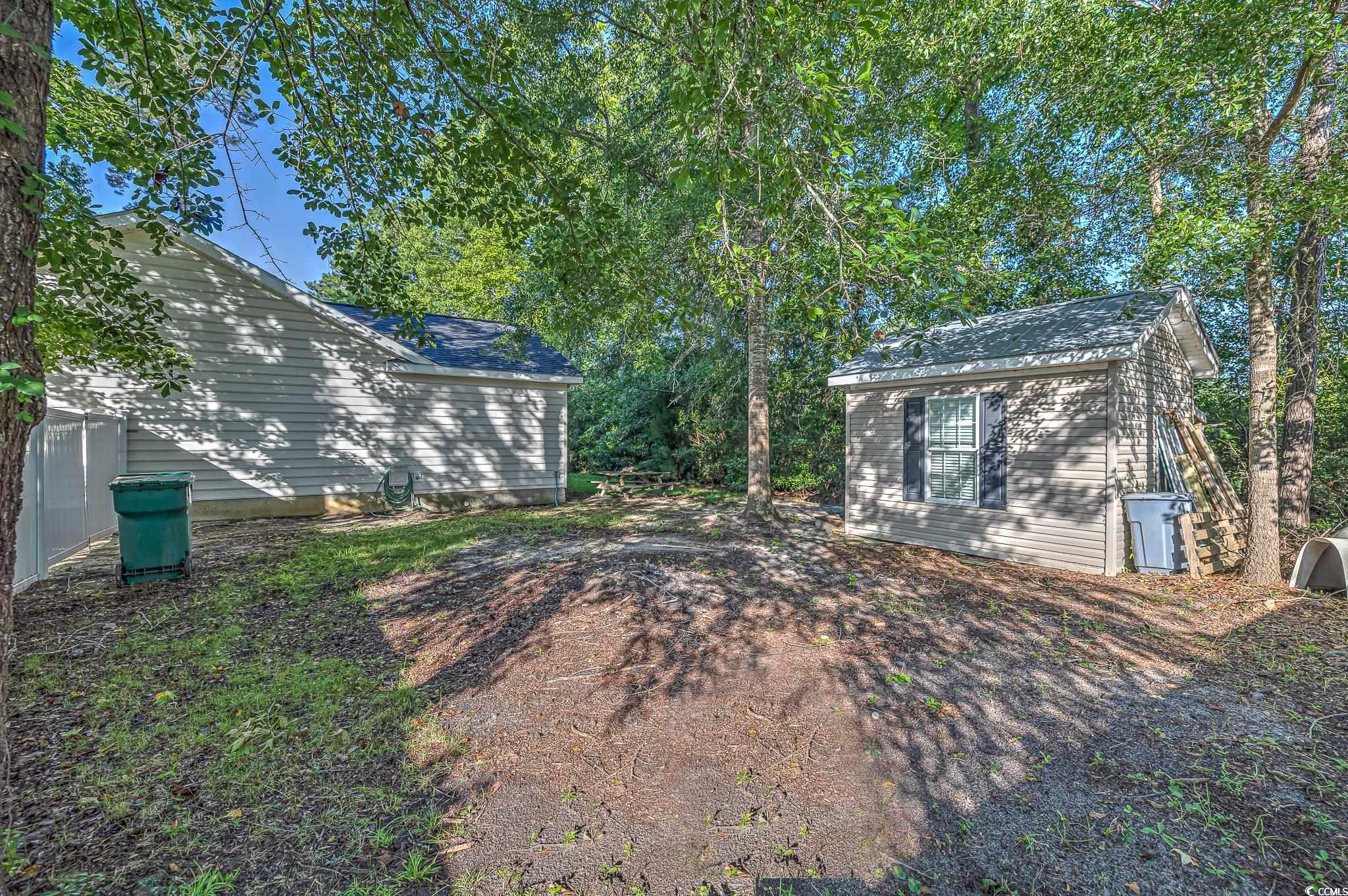 4000 Bayfield Loop Murrells Inlet, SC 29576 - Photo 5 of 33 View of yard with an outdoor structure